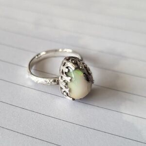 Moonstone ring with ornate sterling silver setting.  Size 7.5